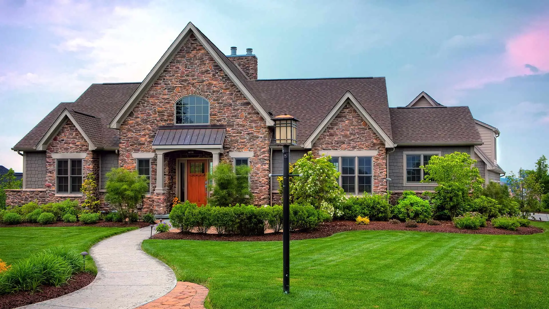 Gorgeous stone with currated lawn and landscaping home in Charlotte, NC.