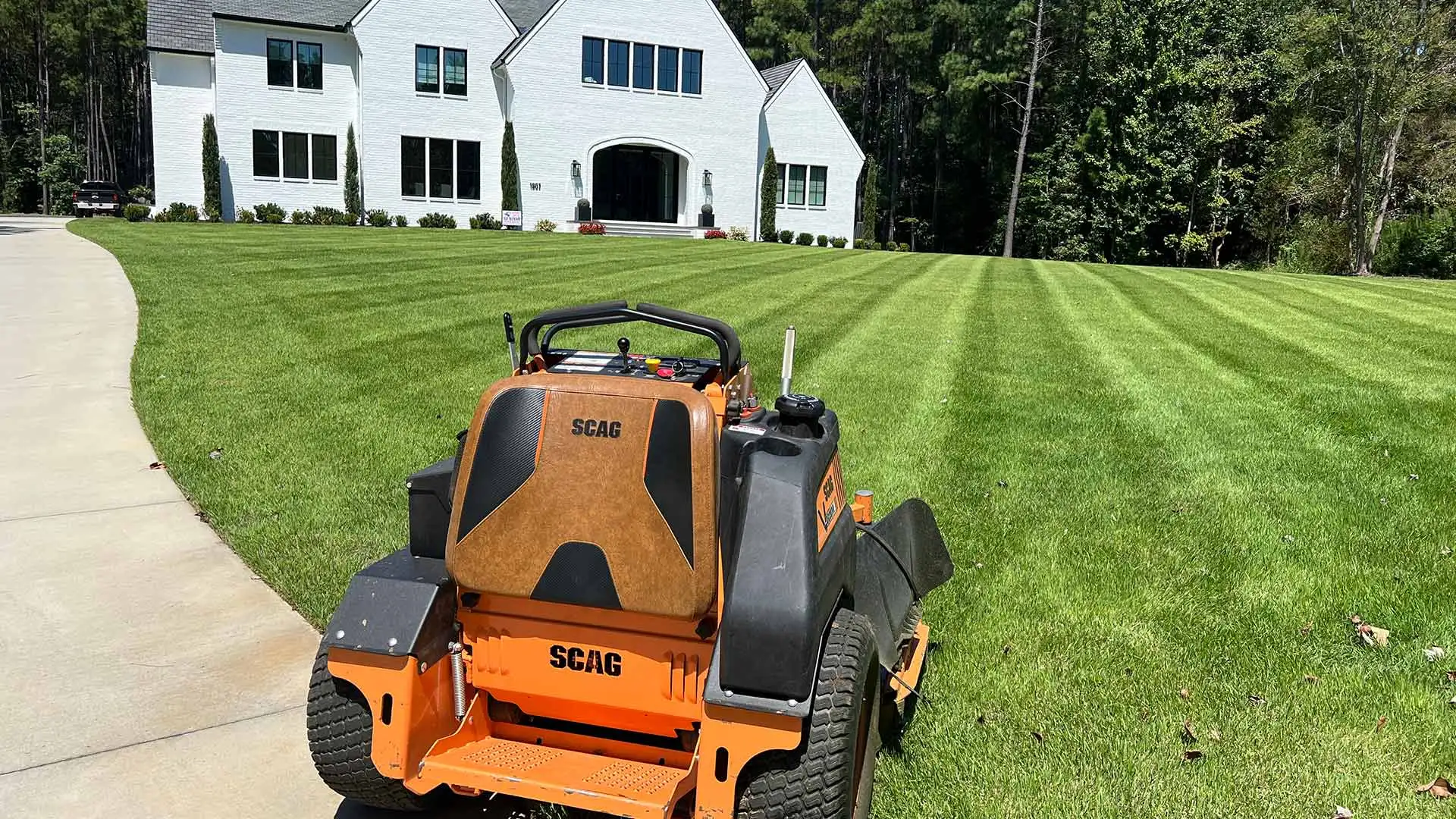 Lawn mower resting after a full lawn mowing service in Matthews, NC.