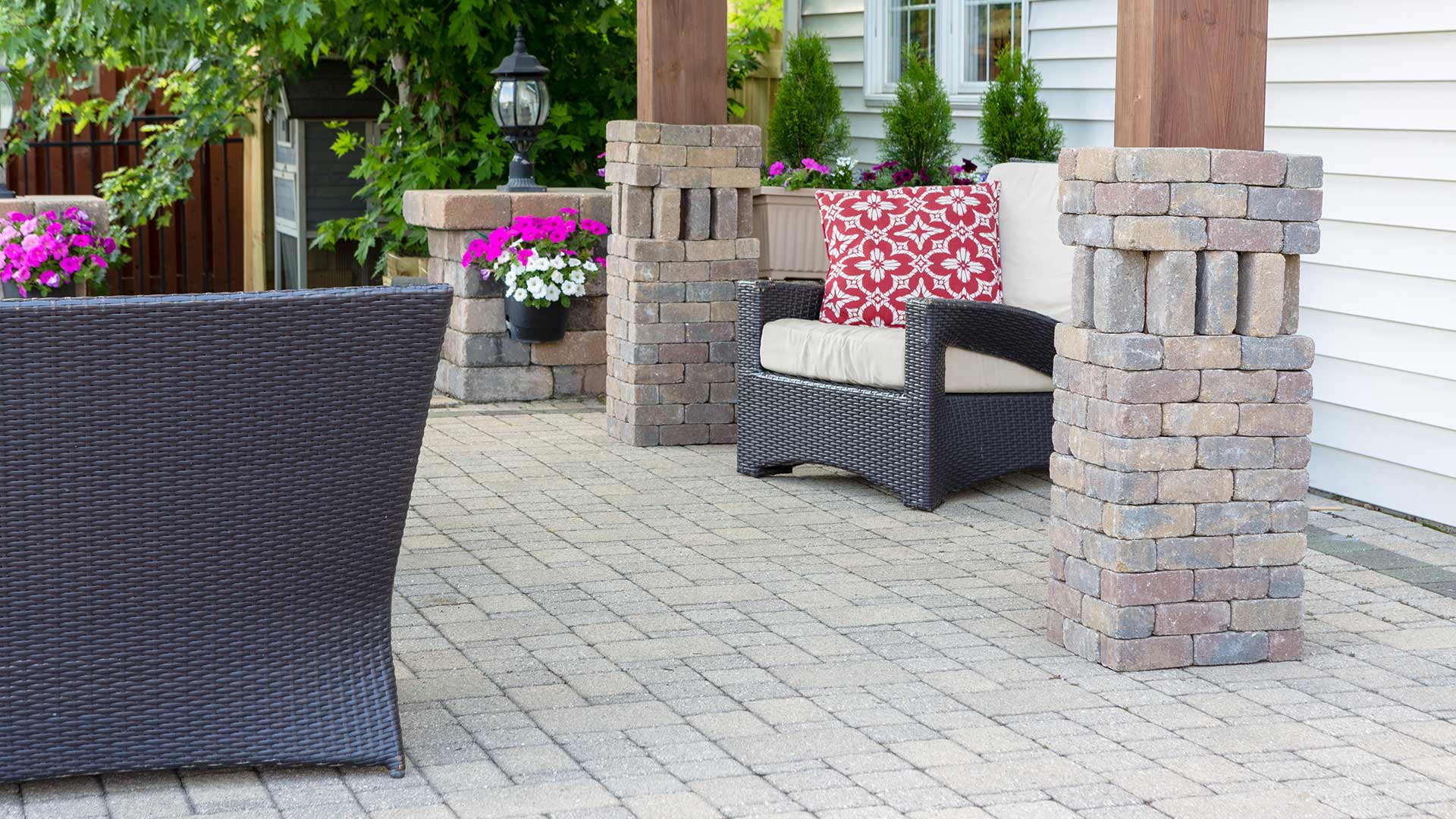 Stone paver patio with great seating and beautiful flowers near Matthews, NC.