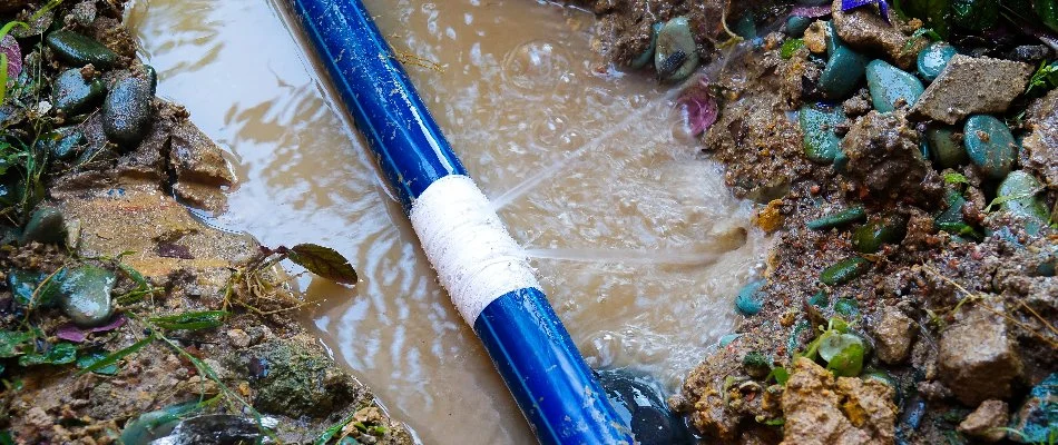 Cracked water line in Matthews, NC, with white tape.