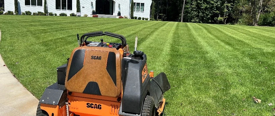 Mower on a green lawn in Matthews, NC.