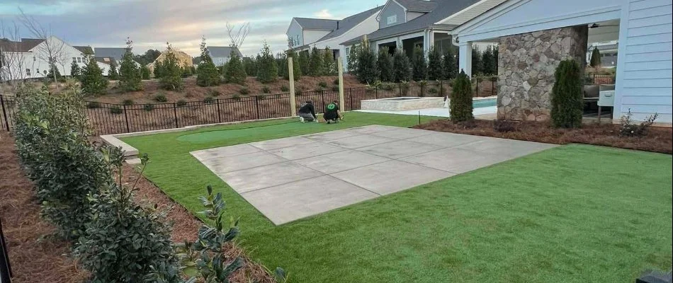 Outdoor space in Matthews, NC, with patio, grass, and plants.