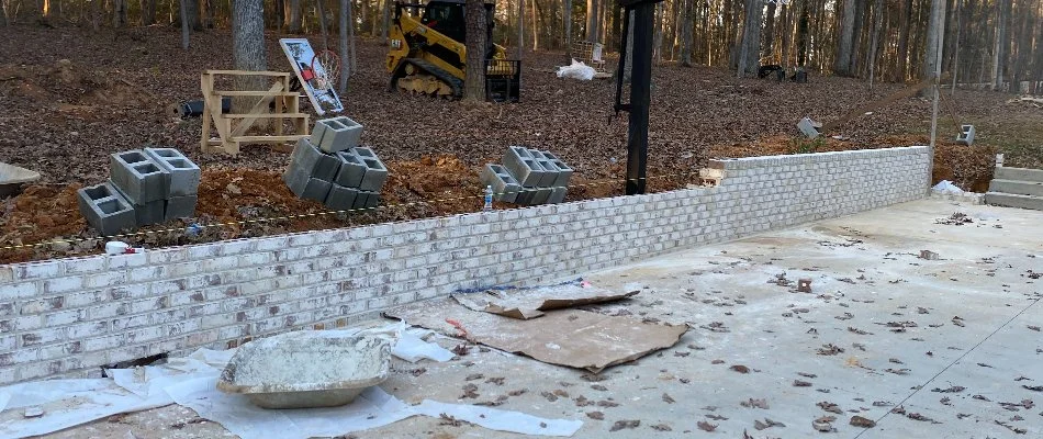 Retaining wall during installation in Matthews, NC.
