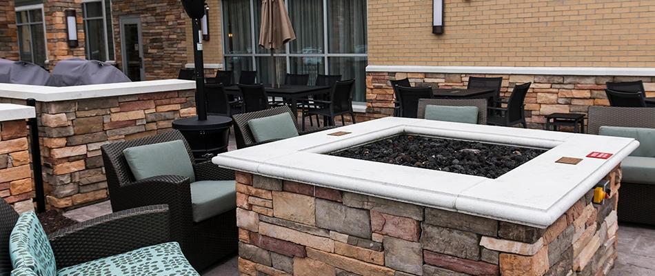 Beautiful fire pit surrounded by cozy chairs at a restaurant near Charlotte, NC.