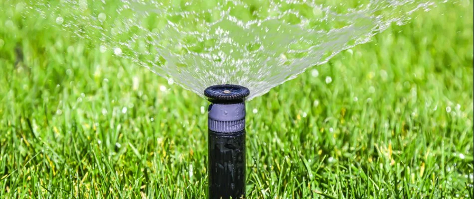 Irrigation system spraying water on a lawn in Mount Pleasant, NC.