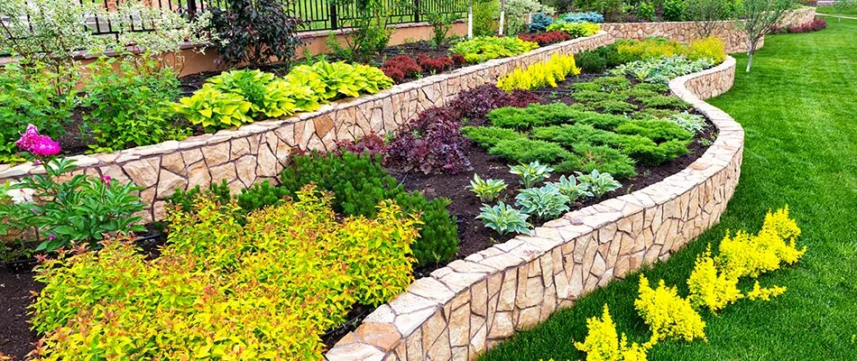 Imaculately designed and crafted retaining wall with flagstones near Matthews, NC.